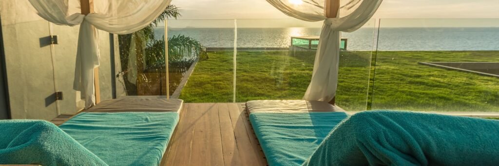 "Advice on enhancing the home spa experience by investing in luxurious items like a plush robe and comfortable slippers, aiming to replicate the opulent and professional feel of a high-end spa."
